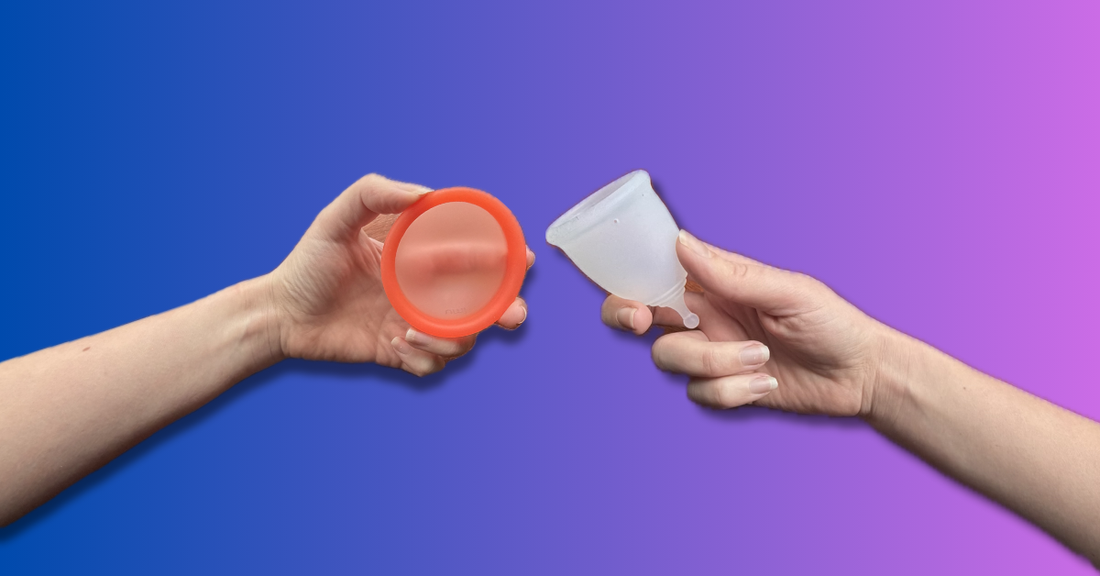 Hand holding an umi cycle menstrual disc and a clear menstrual cup for comparison